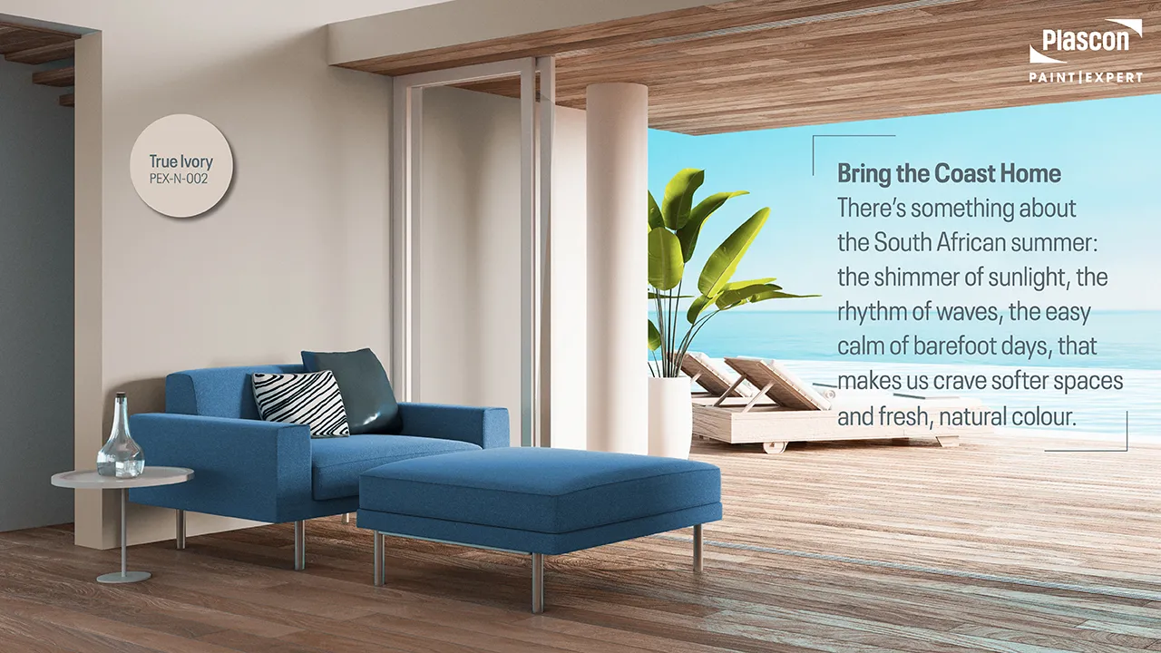 Modern coastal living space featuring True Ivory walls and ocean views, highlighting warm neutral tones from the Paint Club Bespoke Colour Collection.